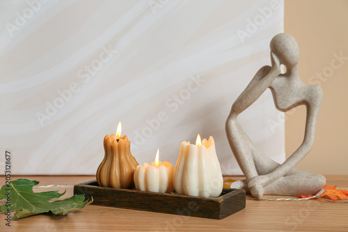 Wooden tray with burning ca...