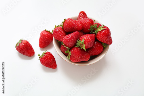 Bowl with sweet fresh straw...