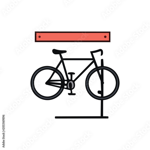 A black bicycle is suspended from a red rack, ready for maintenance or storage.