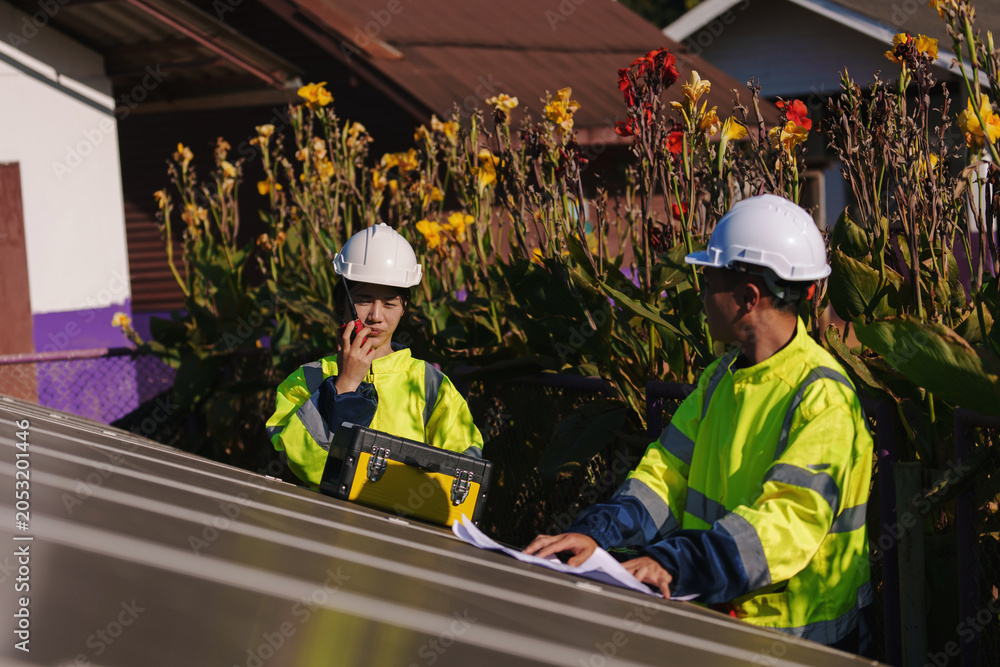 Fototapeta premium Technicians are working on installing solar panel systems in remote rural areas. 