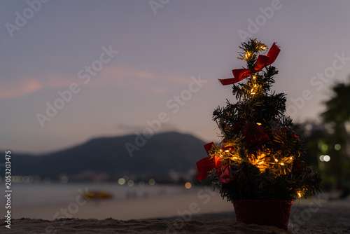 Cute and Christmas Tree House Relaxing on the Beach. Merry Christmas Holiday. Bright Background. Patong Beach, Phuket, Thailand.