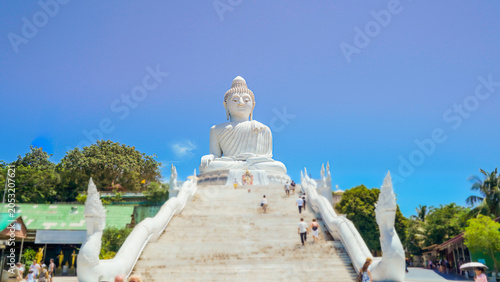 Phuket Big Buddha statue. afternoon light sky and blue ocean are on the back of white Phuket big Buddha is the one of landmarks on Phuket island Thailand.