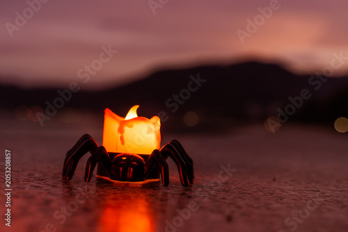 Concept: Halloween beach and ocean background with spider, witch, ghost, dark, scary tone.