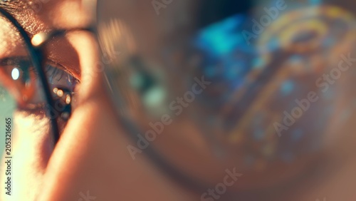 Obraz na płótnie A close-up of a person’s eye in glasses reflecting a digital key icon represents data security, privacy awareness, identity protection and the importance of digital access control in the modern world