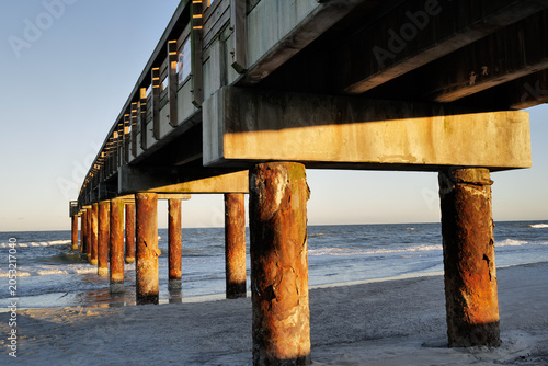 Photography The wooden pier on St. Augustine Beach in Florida at Sunset