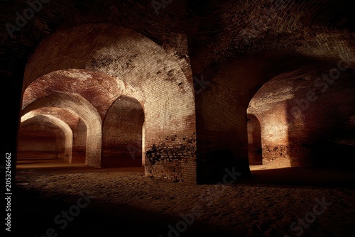 Abstract underground tunnel with glowing red and yellow brick arches and dappled light creating an atmospheric and mysterious ambiance