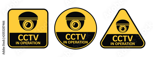 Konstfotografi CCTV in operation signs three yellow warning labels with security camera icons,
