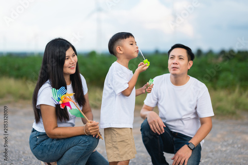 Family of three shares a joyful moment outdoors