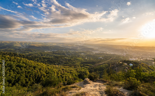 View of the mountains and Kislovodsk from the observation decks of the Kislovodsk Park. Evening sunset over the mountains of Kislovodsk.