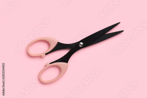 Black scissors with pink ha...