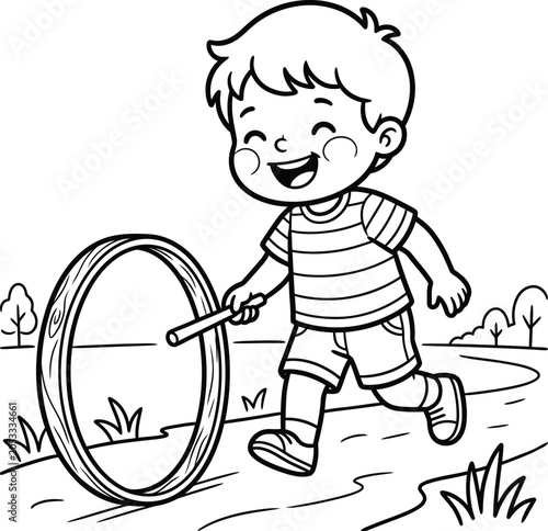 Photos A joyful young boy running through the grassy outdoors while playfully pushing a large wooden hoop with a small stick tool