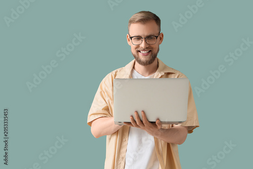 Smiling young man in glasse...