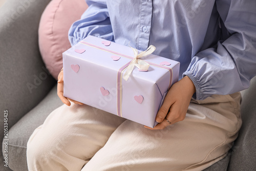 Woman holding lavender gift...