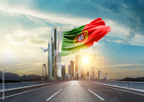 Vászonkép Portugal flag waving with modern and developed landscape