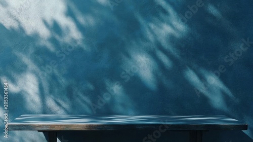 Teal Stucco Wall with Wooden Console Table and Dappled Sunlight Shadows