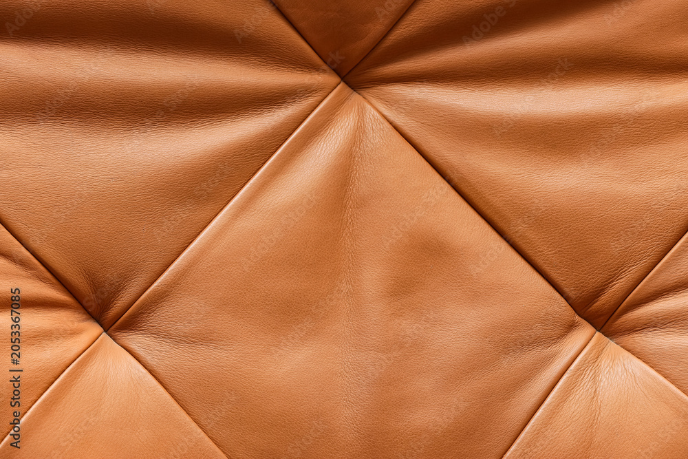 Naklejka premium Brown leather upholstery with diamond tufting pattern, luxury furniture material texture background