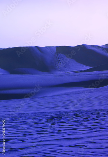 Pop art surreal style royal blue colored desert with fantastic sand dunes