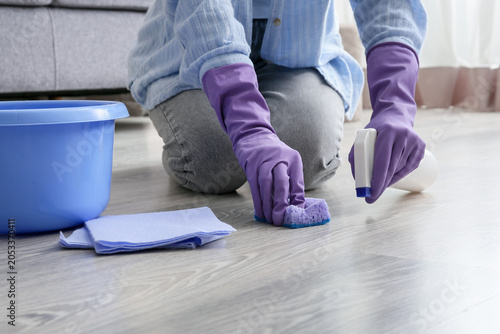 Person in purple gloves cle...