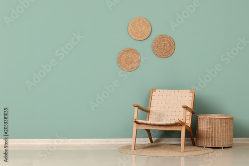 Quadro su tela Modern minimalist interior design with woven chair, rattan basket, and wall deco