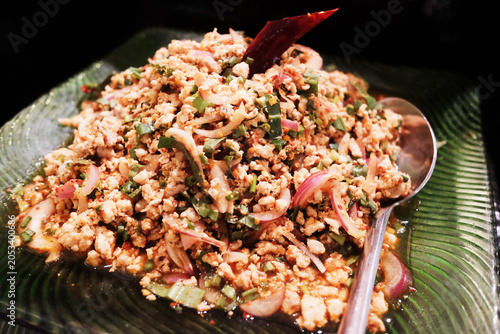 Fresh Spicy minced pork in a dish. Traditional Thai food