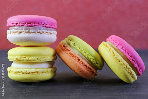 Vibrant pop art style photography featuring colorful desserts on a dark high contrast background