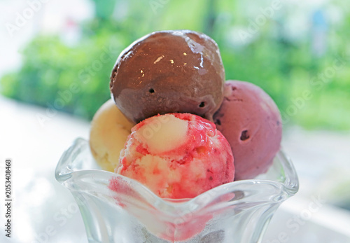 Closeup of colorful assorted ice cream scoops in a sundae glass