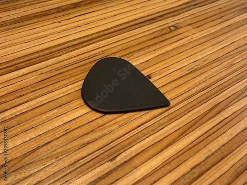 Guitar pick or plectrum on the desk
