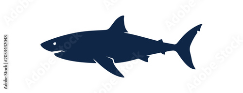 Silhouette of a Great White Shark swimming in the ocean.