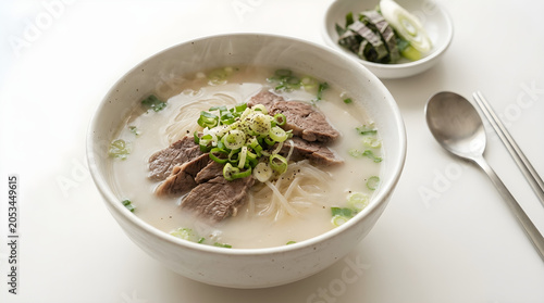 Delicious Traditional Korean Beef Bone Soup Seolleongtang Served with Sliced Beef and Scallions in a Bowl