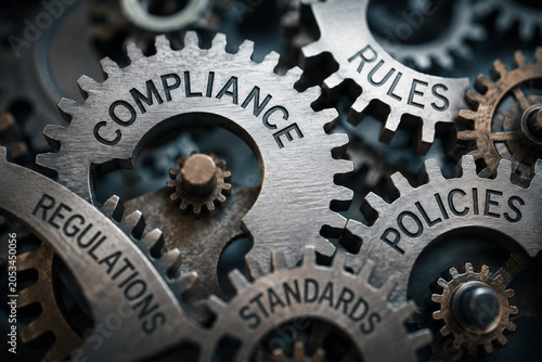 AI generated interconnected metal gears representing compliance regulations policies standards governance risk management corporate control within an organized business framework