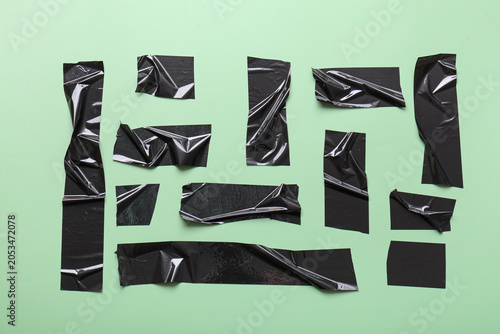 Black duct tape pieces on g...