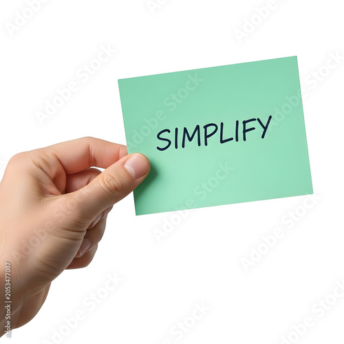 Human hand holding a light green sticky note with simplify on transparent background
