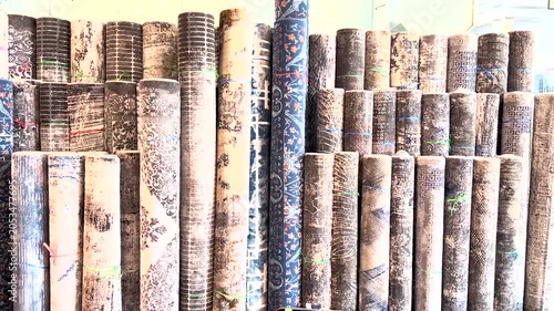 Multiple Persian carpets for sale at the store. Traditional hand-woven rugs with Vibrant colors.
