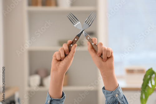 Child's hands holding two f...