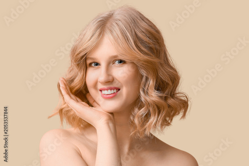 Smiling young woman with wa...