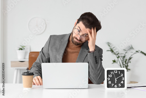 Stressed businessman overwh...