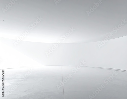 Modern, minimalist interior of a white, curved space with bright natural lighting