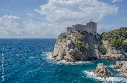 The historic Fort Lovrijenac on a rocky cliff and the blue Adriatic Sea in Dubrovnik, Croatia, on a sunny day