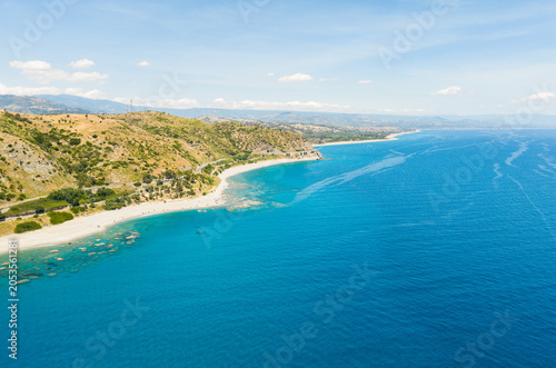 The Italian coast in Calabria with blue sea and clear waters aerial view