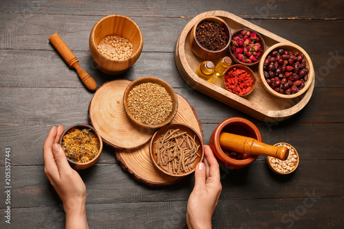 Female hands with bowls of ...