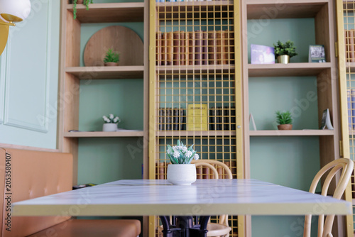 Stylish Cafe Interior with Bright Green Wall and Modern Design
