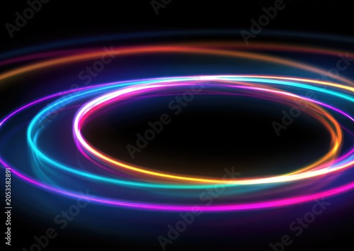 A vibrant image of light trails, forming concentric ovals, glows with neon colors against a black backdrop. The circles radiate a sense of energy