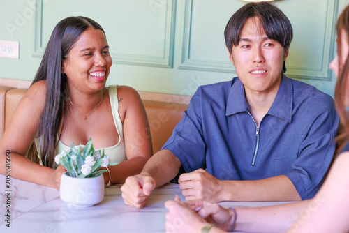 International University Students Chatting in a Cafe