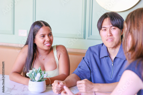International University Students Chatting in a Cafe