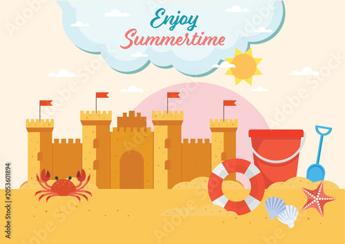 Summertime sandcastle with beach toys