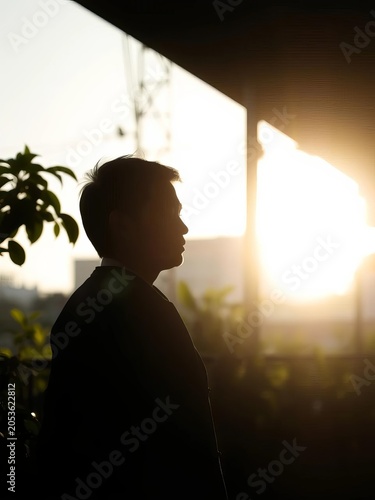 Shadowed silhouette finds solace amidst urban green, a silent vow to a cleaner tomorrow,  hope,  eco