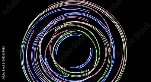Colorful neon light trails on black background