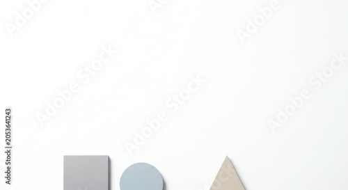 Grey square blue circle and beige triangle on white background