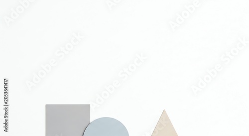 Grey square blue circle and beige triangle on white background