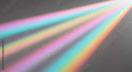 Rainbow light beams on gray background